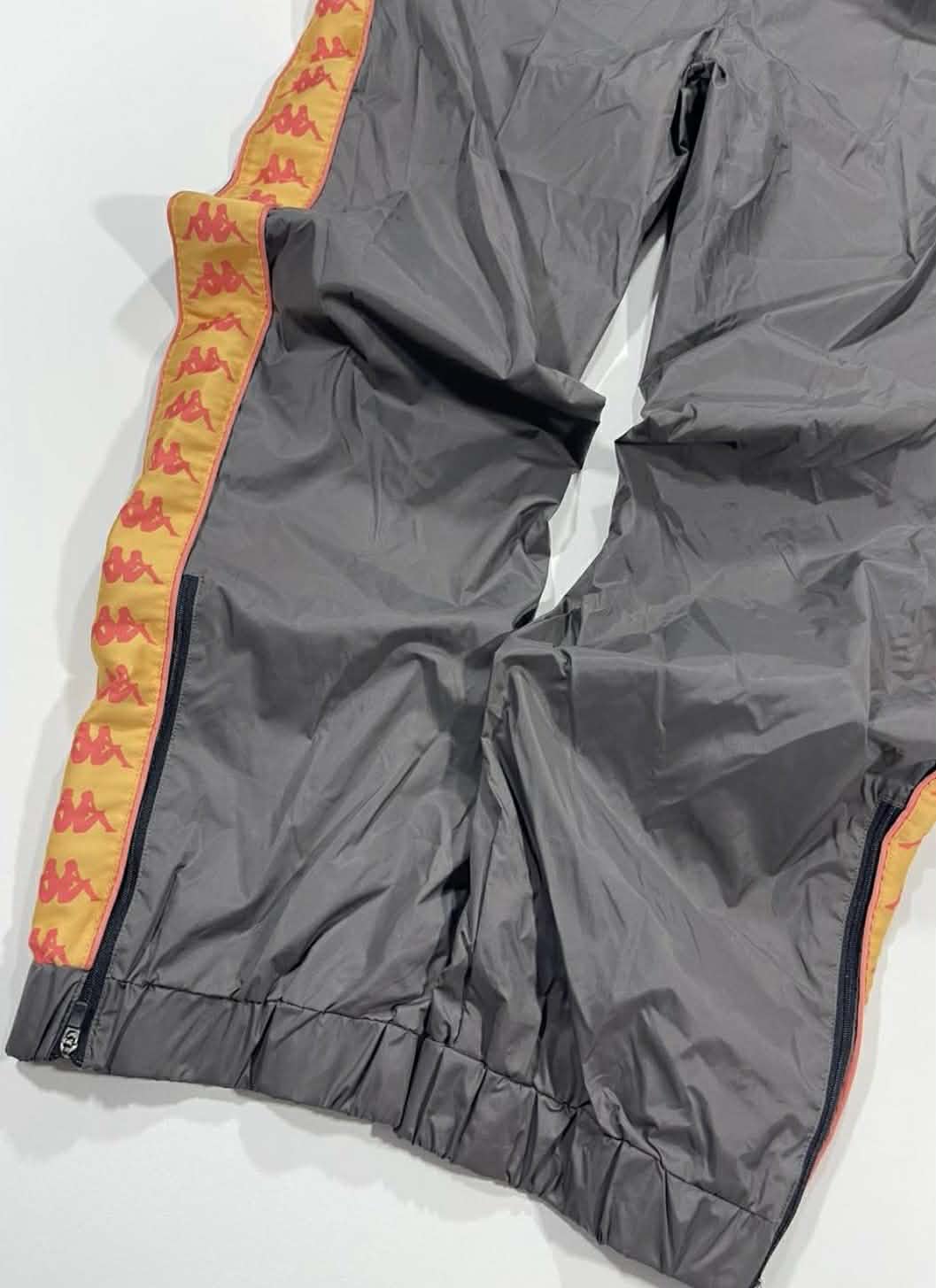 BRANDNEW KAPPA GREY TRACK PANTS WITH ORANGE STRIPES AND LOGO (M)