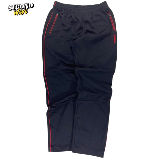 VINTAGE REEBOK BLACK TRACK PANTS WITH RED ACCENTS AND ZIPPER POCKETS (34)