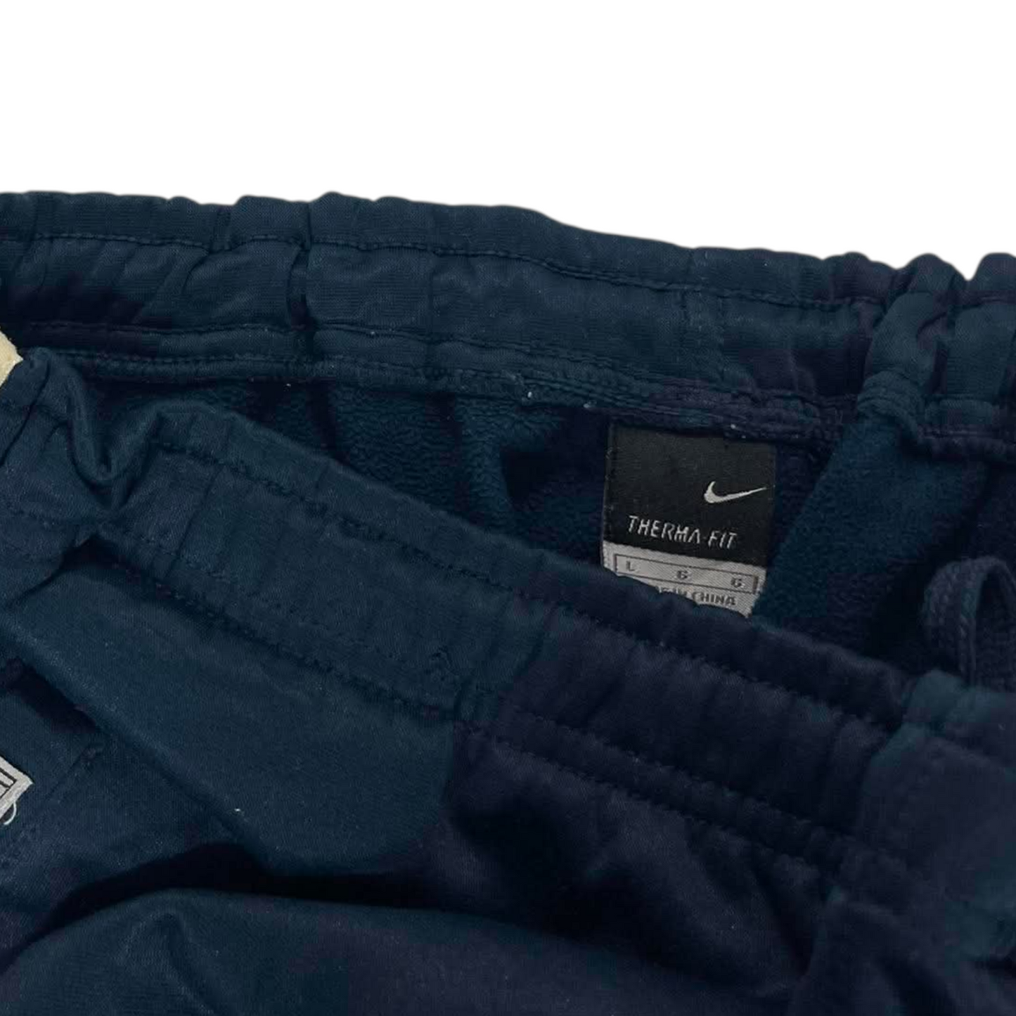 VINTAGE NIKE NAVY BLUE TRACK PANTS (L) ²