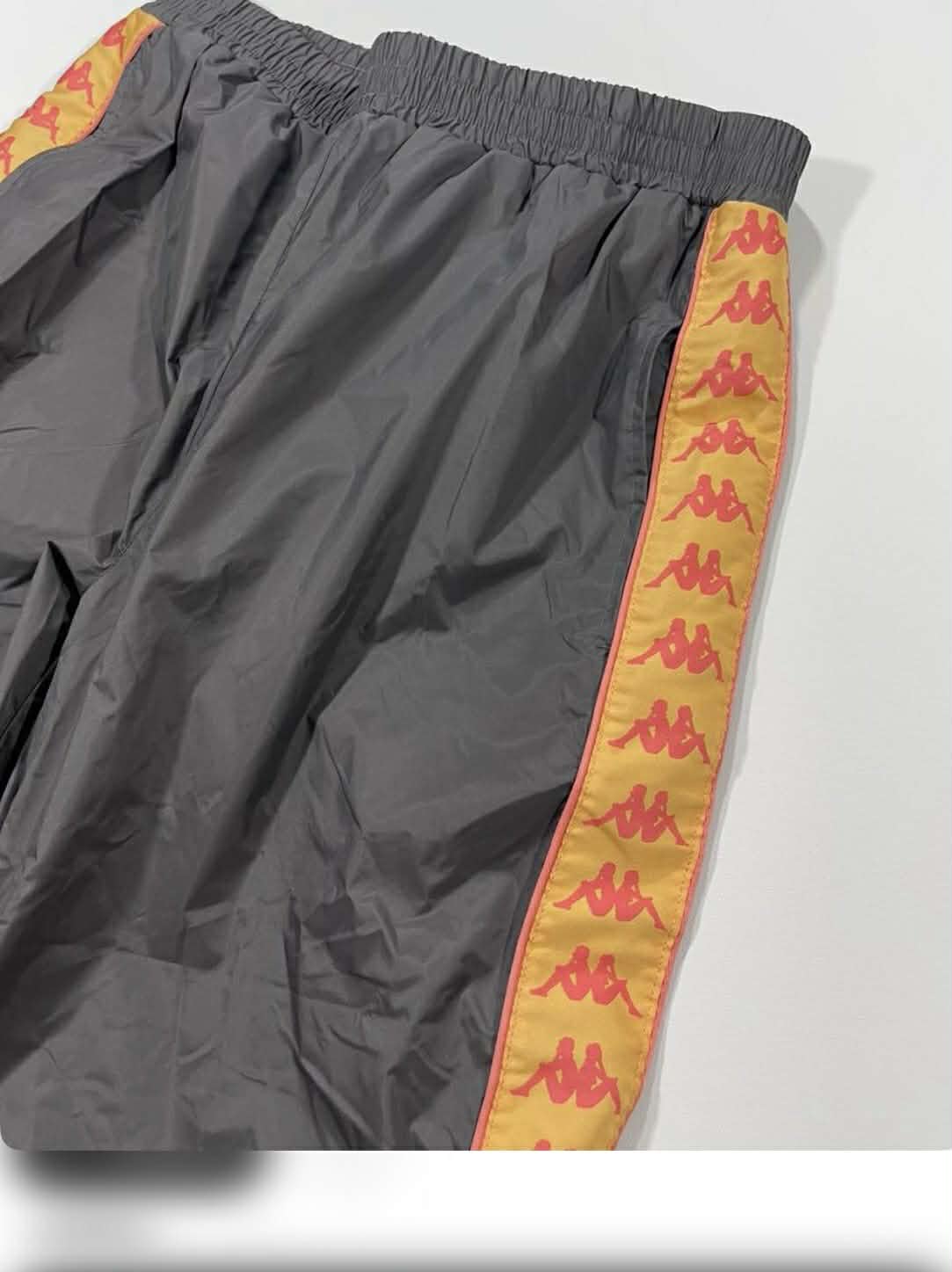 BRANDNEW KAPPA GREY TRACK PANTS WITH ORANGE STRIPES AND LOGO (M)