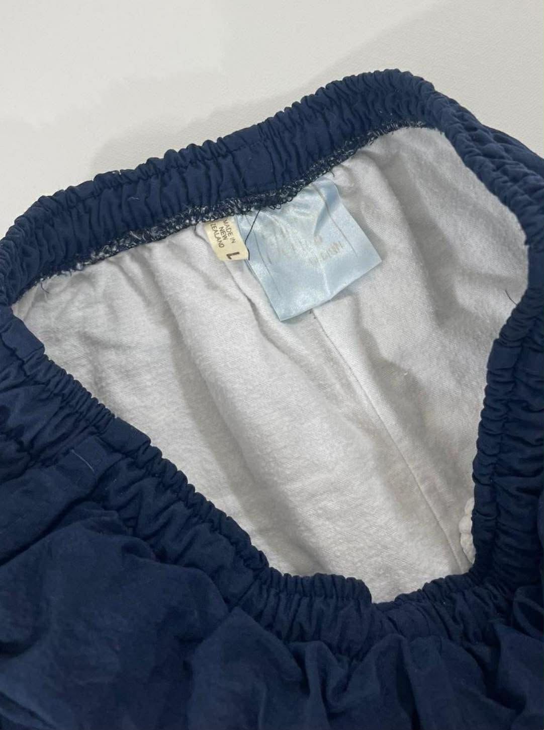 VINTAGE 90s NAVY BLUE TRACK PANTS WITH WHITE AND GREEN STRIPES (M-L)